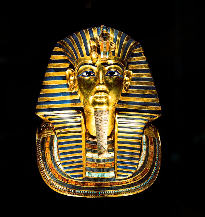 A stunning image of the golden mask of Pharaoh Tutankhamun, showcasing rich ancient Egyptian culture and artistry.